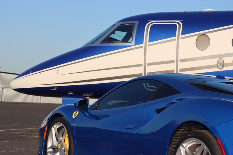 Ferrari and Saturn Aviation charter jet on a runway